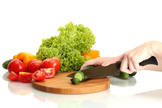 hands preparing fresh vegetables in kitchen